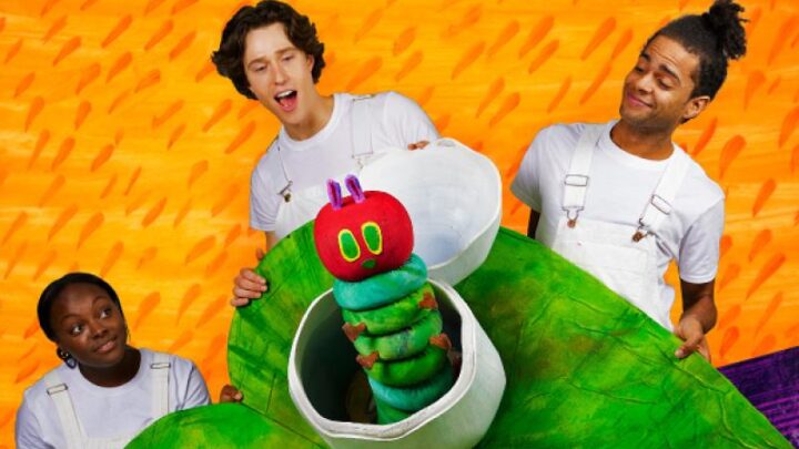 A green Very Hungry Caterpillar with 3 actors